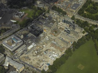 Oblique aerial view centred on the former Royal Infirmary, now Quartermile re-development, taken from the SW.