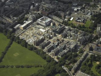 Oblique aerial view centred on the former Royal Infirmary, now Quartermile re-development, taken from the SE.