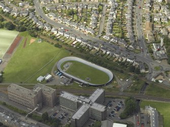 Oblique aerial view centred on the velodrome, taken from the SE.