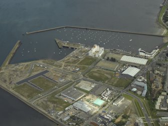 Oblique aerial view of the harbour and industrial estate, taken from the SW.