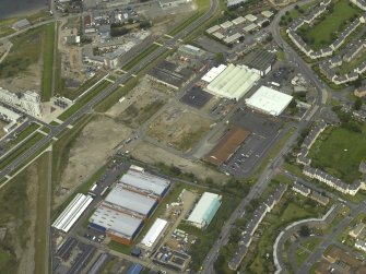 Oblique aerial view centred on site of new RCAHMS archive store, taken from the SW.
