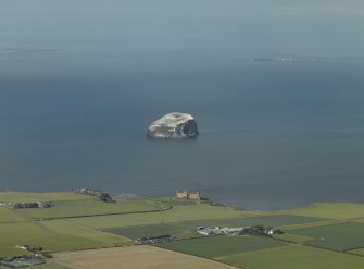 General oblique aerial view of the Bass Rock with Tantalon Castle adjacent, taken from the S.