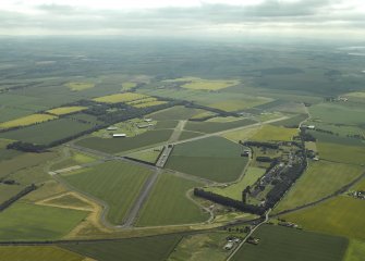 General oblique aerial view centred on the airfield, taken from the ENE.