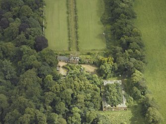 Oblique aerial view centred on the stables with the walled garden adjacent, taken from the NW.