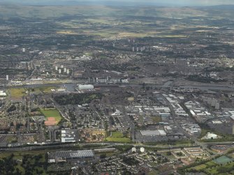 General oblique aerial view centred on the shipyard and industrial estates, taken from the SSW.