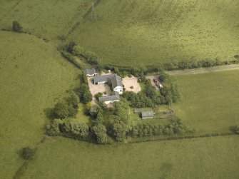 Oblique aerial view centred on the farmsteading, taken from the SW.