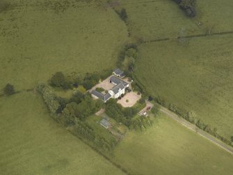 Oblique aerial view centred on the farmsteading, taken from the SSW.