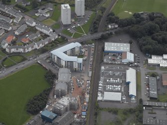 Oblique aerial view centred on Drybrough Crescent showing second phase of new housing development under construction, taken from the NNE.