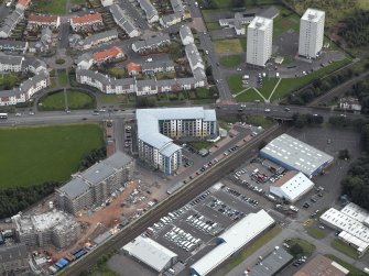 Oblique aerial view centred on Drybrough Crescent showing second phase of new housing development under construction, taken from the NNW.