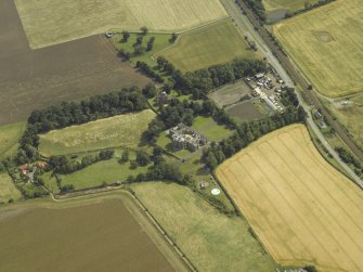 General oblique aerial view centred on the house, taken from the W.