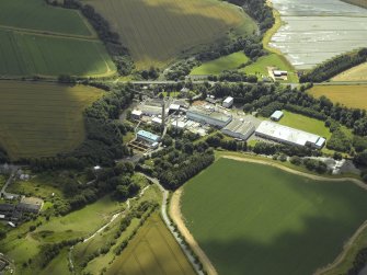 Oblique aerial view centred on the paper mill, taken from the NNW.