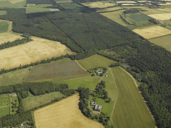 Oblique aerial view centred on the house, taken from the WNW.