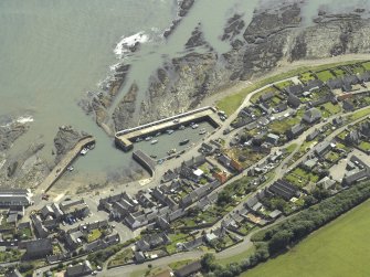 Oblique aerial view centred on the harbour and town, taken from the NW.