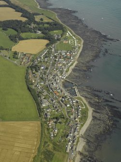 General oblique aerial view centred on the harbour and town, taken from the W.