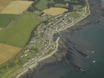 General oblique aerial view centred on the harbour and town, taken from the SW.