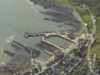 Oblique aerial view centred on the harbour, taken from the NE.