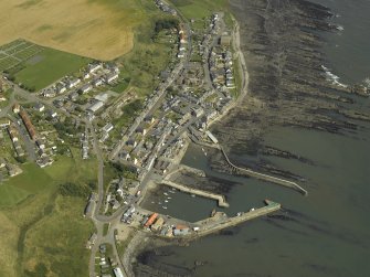 General oblique aerial view centred on the harbour and village, taken from the WSW.