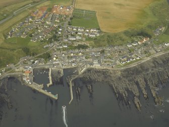 Oblique aerial view centred on the harbour, taken from the S.