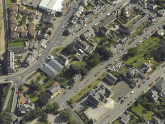 Oblique aerial view centred on Invercowie house and garden, taken from the NW.