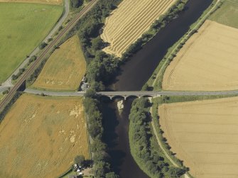 Oblique aerial view centred on the road bridge and the tollhouse, taken from the SE.