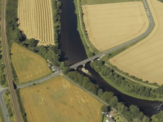 Oblique aerial view centred on the road bridge and the tollhouse, taken from the S.