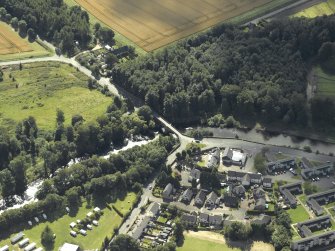 Oblique aerial view centred on the road bridge, taken from the NE.