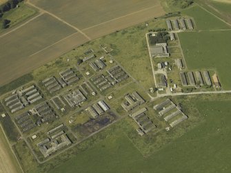 Oblique aerial view centred on the accommodation camp, taken from the S.