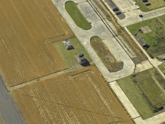 Oblique aerial view centred on the control tower, taken from the NE.