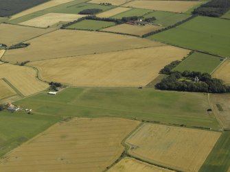 Oblique aerial view centred on grass airfield  with the farmstead adjacent, taken from the NNW.