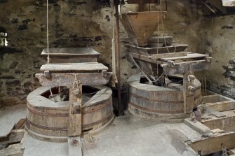 Interior. First floor. Detail of shelling stones on the left, grinding stones on the right.
