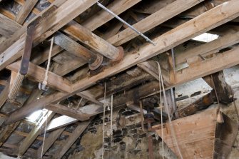 Interior. First floor. Roof space, note hopper above grinding stones and sack hoist mechanism