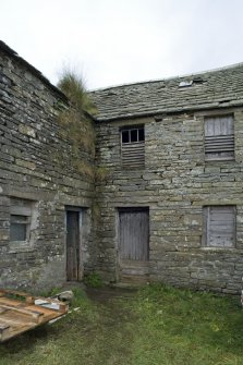 View of milling area to left and storage are to right.