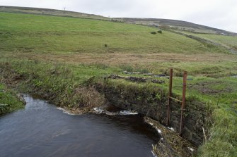 View looking S, outer face of dam wall and sluice gate.