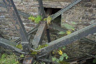 Detail of waterwheel axle as it enters the mill building.