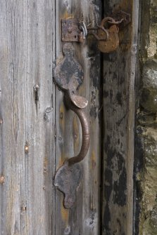Detail of original door handle on storage area door.