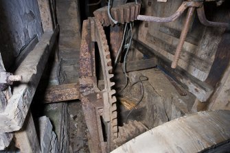 Interior. Ground floor. Milling area. Gear cupboard showing pit wheel and wallower.