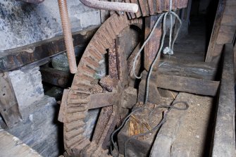 Interior. Ground floor. Milling area. Gear cupboard showing pit wheel and wallower.