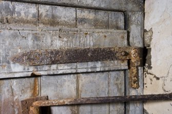 Interior. Ground floor. Milling area. Detail of original door hinge.