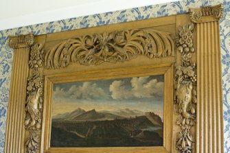 Interior.  Detail of wood carving and 17th century painting of Edinburgh above fireplace in 'Blue Room.