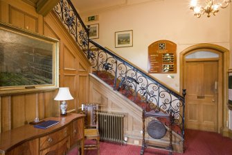 Interior.  General view of entrance hall showing late 17th century wrought-iron staircase.