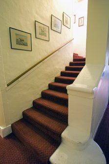 Interior. Staircase to ground floor from basement.
