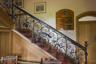 Interior.  General view of late 17th century wrought-iron staircase balustrade in hallway.