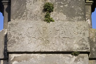 Detail.  Carved stone on Gate Pier 'CAR H W Posuit'.