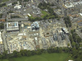 Oblique aerial view centred on former Infirmary, taken from the S.