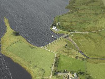Oblique aerial view centred on the dam and pier, taken from the E.