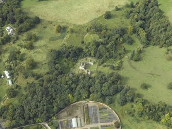 Oblique aerial view centred on the house and walled garden with the earthwork and Blairesk Hall adjacent, taken from the SE.