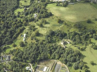 Oblique aerial view centred on the house and walled garden with the earthwork and Blairesk Hall adjacent, taken from the SW.