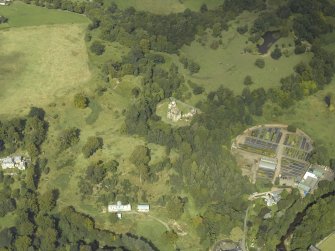 Oblique aerial view centred on the house and walled garden with the earthwork and Blairesk Hall adjacent, taken from the S.
