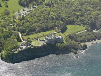 Oblique aerial view centred on the Castle with the stable block adjacent, taken from the N.