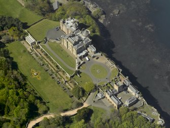 Oblique aerial view centred on the Castle with the stable block adjacent, taken from the ESE.